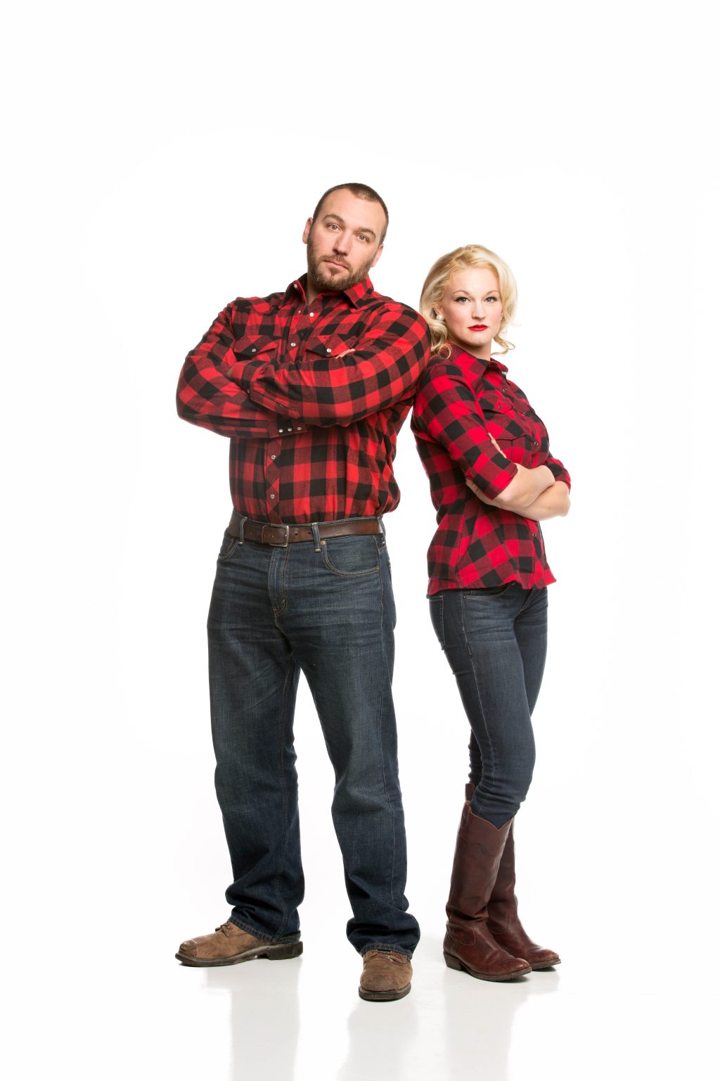 Brad and Lallenia standing with arms folded